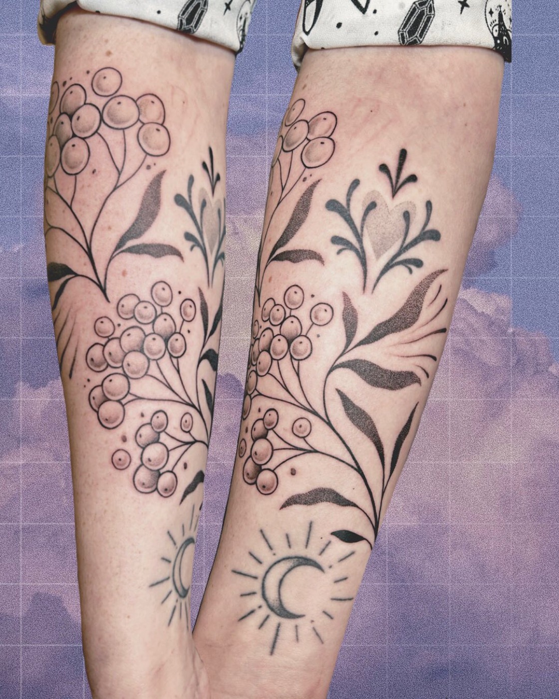 Branches et baies botaniques tatouées en symétrie